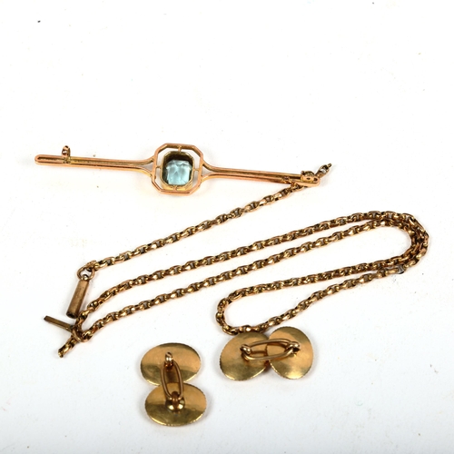 1177 - A 9ct gold and blue topaz set bar brooch, missing clip, 3.9g, a pair of unmarked yellow metal cuffli... 