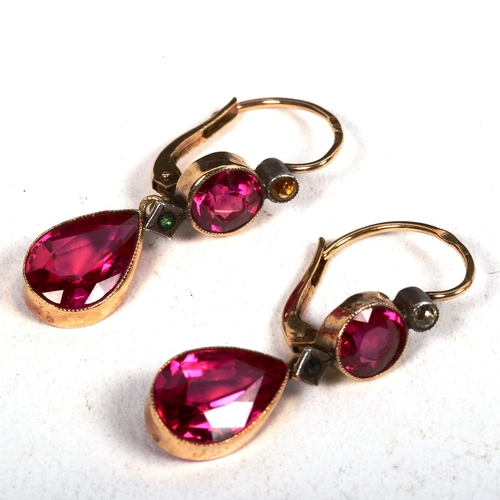 1183 - A pair of 14ct gold and red stone set tear-drop design earrings, 3.8g