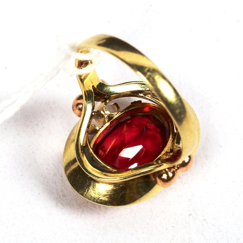 1185 - A stylised 14ct gold and red stone set dress ring, 6.1g, size O