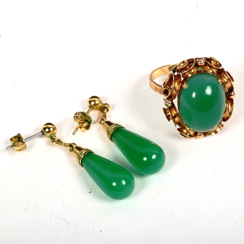 1186 - A 14ct gold and green cabochon stone set dress ring in scrolled mount, 6g, size P, and a pair of gre... 