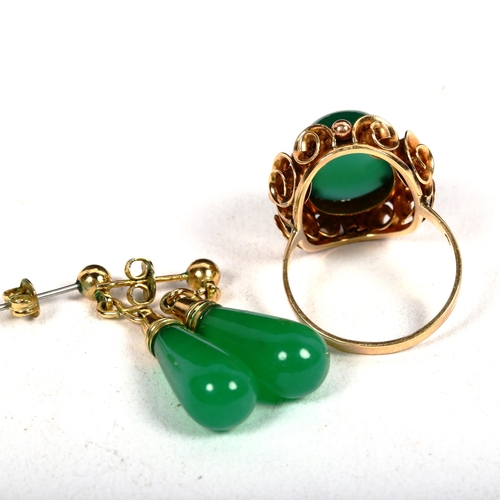 1186 - A 14ct gold and green cabochon stone set dress ring in scrolled mount, 6g, size P, and a pair of gre... 