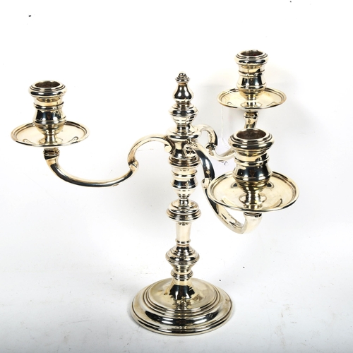 1192 - A late 20th century silver 3-branch table candelabra (converts to single candlestick), height 25cm