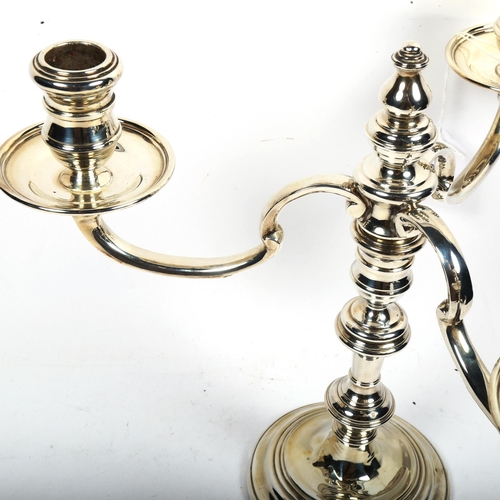 1192 - A late 20th century silver 3-branch table candelabra (converts to single candlestick), height 25cm