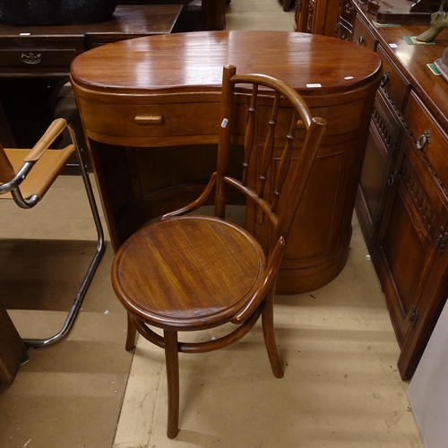 2133 - A mid-century mahogany kidney-shaped kneehole writing desk, with 2 frieze drawers and cupboard under... 