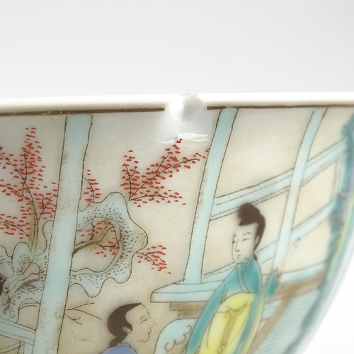 483 - A Chinese porcelain bowl with painted figure panels and 6 character mark, 16cm across