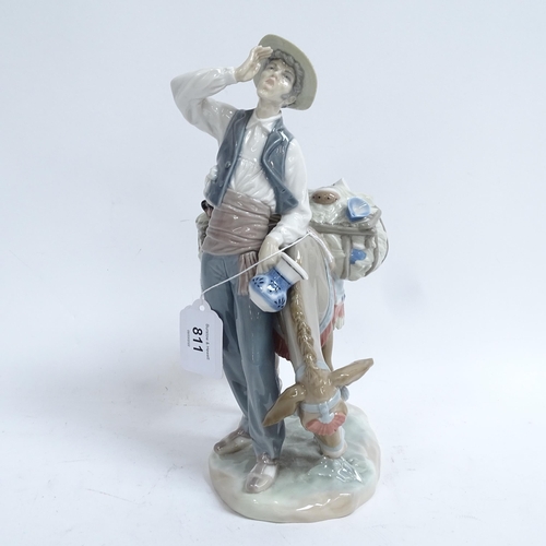 811 - A Lladro porcelain figural group, man with donkey, height 27cm