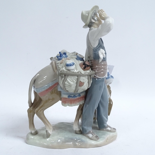 811 - A Lladro porcelain figural group, man with donkey, height 27cm