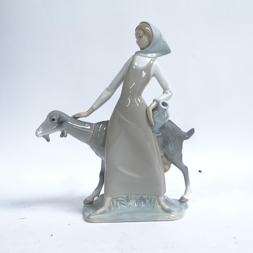 812 - A Lladro porcelain figural group, girl with goat, height 28cm