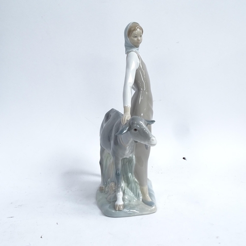 812 - A Lladro porcelain figural group, girl with goat, height 28cm