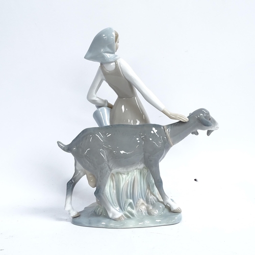 812 - A Lladro porcelain figural group, girl with goat, height 28cm