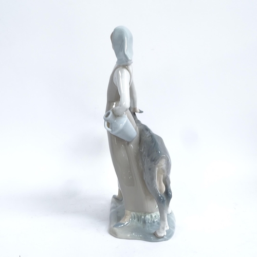 812 - A Lladro porcelain figural group, girl with goat, height 28cm