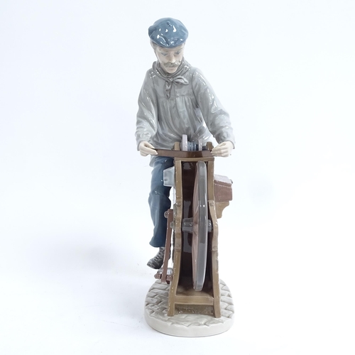 813 - A Lladro porcelain figural group, sharpening the cutlery, height 30cm