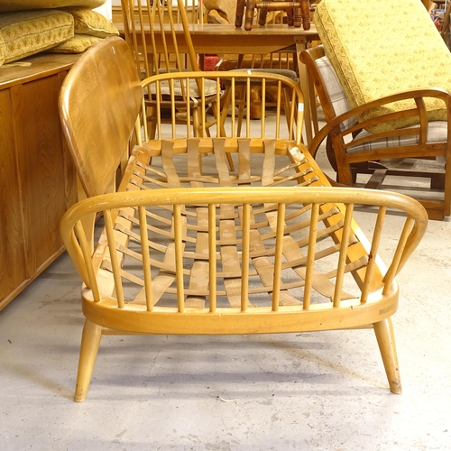 2674 - A mid-century Ercol elm and beech day bed/settee, L200cm, together with a matching footstool