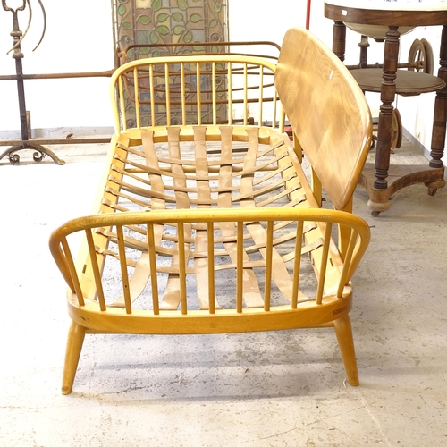 2674 - A mid-century Ercol elm and beech day bed/settee, L200cm, together with a matching footstool