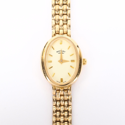 61 - ROTARY - a lady's 9ct gold quartz bracelet watch, oval champagne dial with baton hour markers and 9c... 