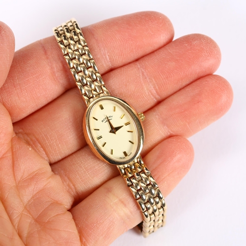 61 - ROTARY - a lady's 9ct gold quartz bracelet watch, oval champagne dial with baton hour markers and 9c... 