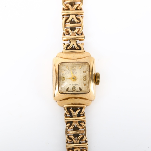 63 - OLMA - a lady's Vintage 9ct gold mechanical bracelet watch, textured silvered dial with gilt quarter... 