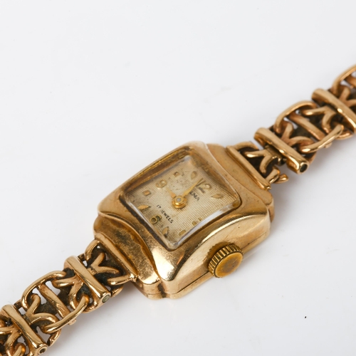 63 - OLMA - a lady's Vintage 9ct gold mechanical bracelet watch, textured silvered dial with gilt quarter... 