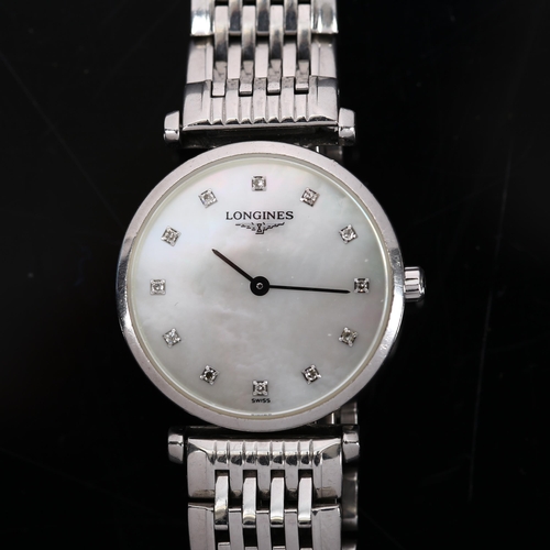 64 - LONGINES - a lady's stainless steel La Grande Classique quartz bracelet watch, ref. L4.209.4, mother... 