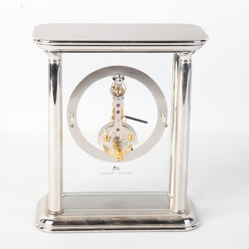 79J - MATTHEW NORMAN - a rhodium plated Helios Skeleton 8-day mantel clock, silvered chapter ring with Rom... 