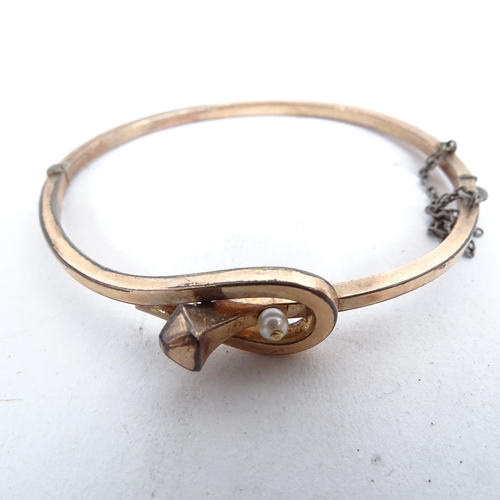 1103 - An embossed gold plated bangle and other gilded jewellery