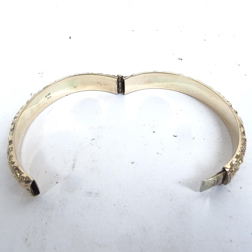 1103 - An embossed gold plated bangle and other gilded jewellery