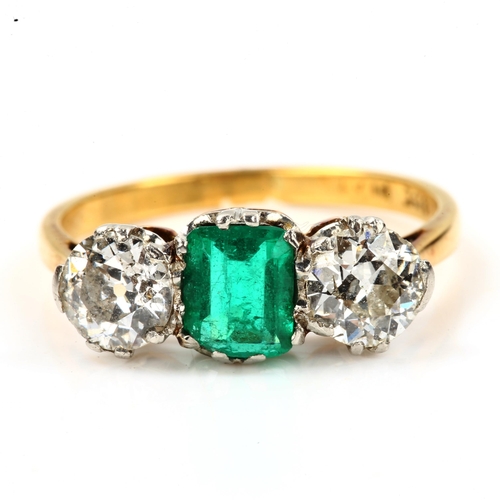 142 - An 18ct gold three stone emerald and diamond ring, platinum topped with emerald-cut emerald and old ... 