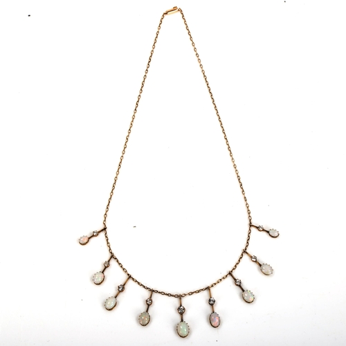 144 - An Edwardian 9ct gold opal and white sapphire fringe necklace, cable links with graduated pendants s... 