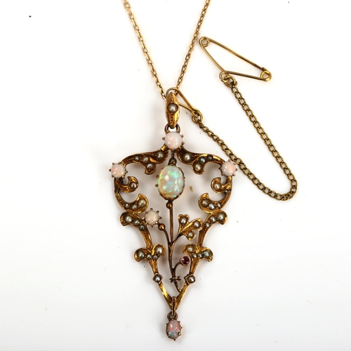 145 - An Edwardian 9ct gold opal ruby and pearl pendant necklace, openwork foliate design set with cabocho... 