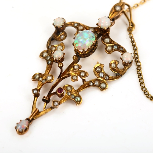 145 - An Edwardian 9ct gold opal ruby and pearl pendant necklace, openwork foliate design set with cabocho... 