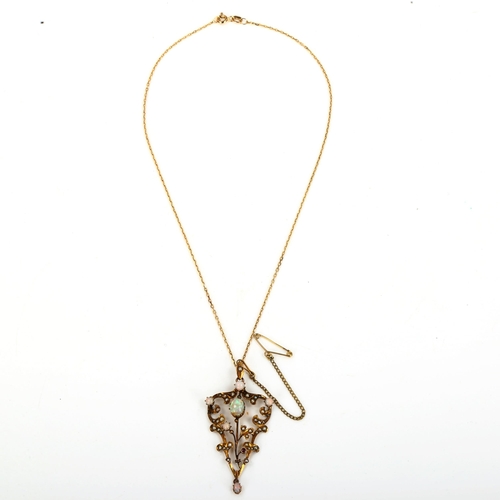 145 - An Edwardian 9ct gold opal ruby and pearl pendant necklace, openwork foliate design set with cabocho... 