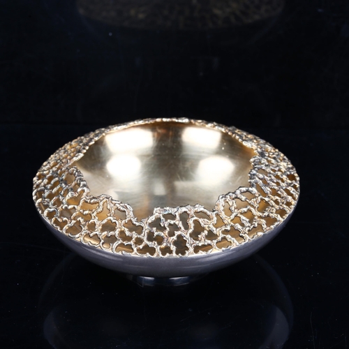 159 - STUART DEVLIN - an Elizabeth II silver and silver-gilt dish/bowl, circular form, with pierced textur... 