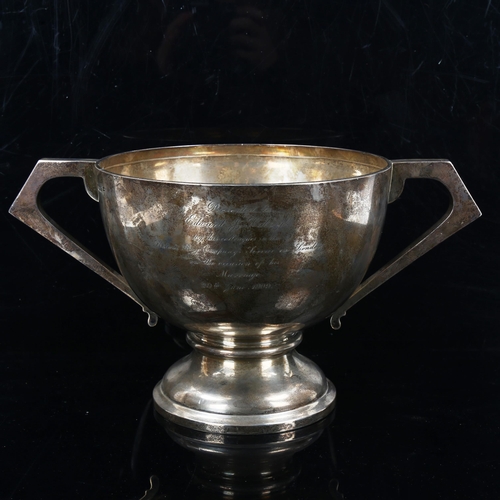 161 - A large Edwardian silver 2-handled trophy, circular form with angular handles and pedestal base, by ... 