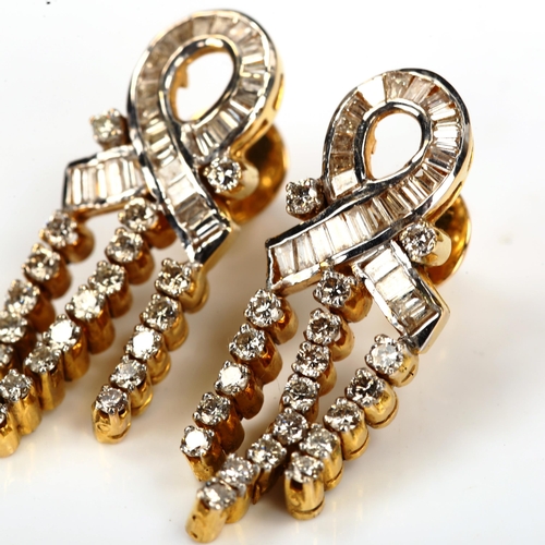 165 - A pair of diamond ribbon earrings, unmarked gold settings, set with baguette and modern round brilli... 