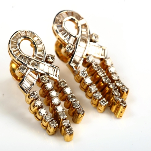 165 - A pair of diamond ribbon earrings, unmarked gold settings, set with baguette and modern round brilli... 