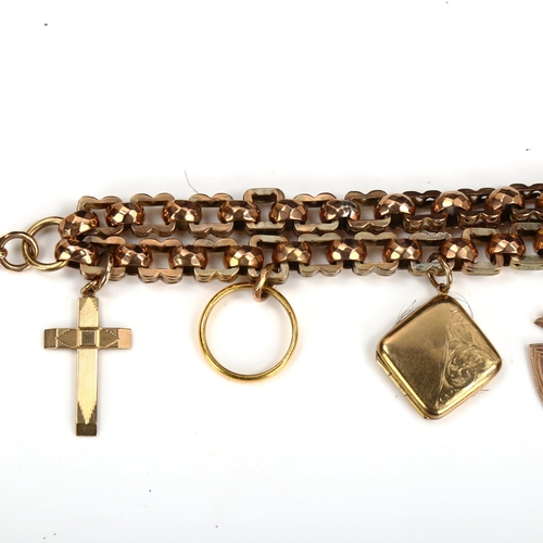 166 - An unmarked gold double fancy link chain charm bracelet, tests as 9ct, with various charms, includin... 