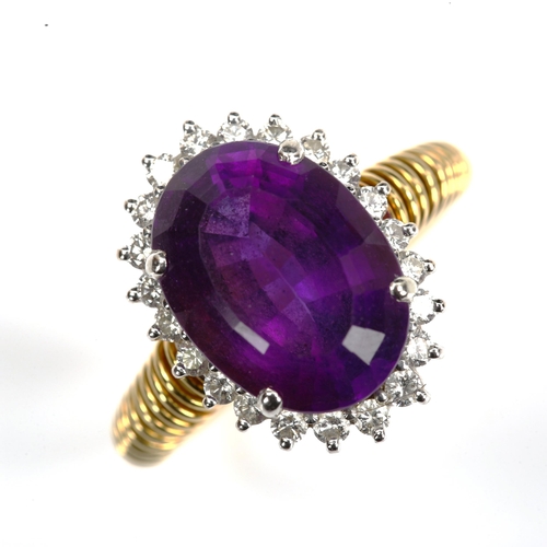 167 - A late 20th century amethyst and diamond cluster dress ring, unmarked gold settings with oval mixed-... 