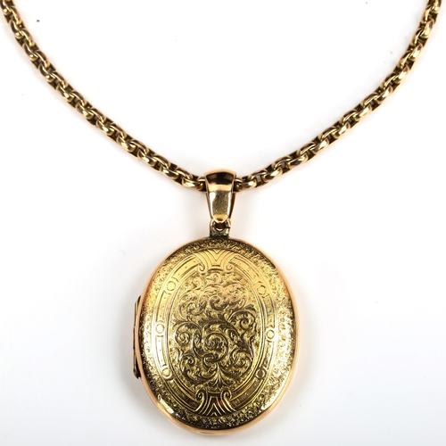 169 - A Victorian unmarked gold locket pendant necklace, allover engraved foliate decoration, on 9ct facet... 