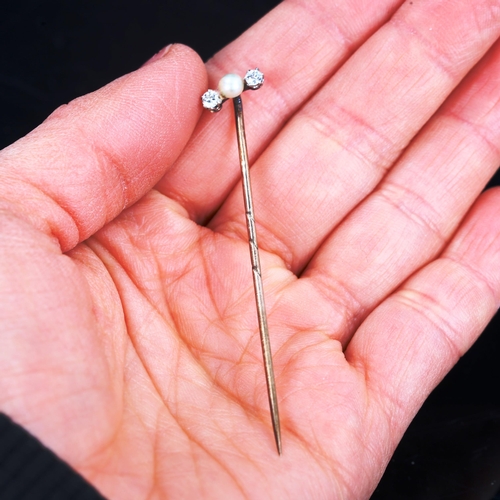 176 - An Antique three stone pearl and diamond stick pin, set with whole pearl and old European-cut diamon... 