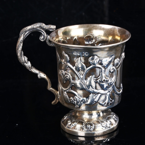 180 - A Victorian silver pedestal christening mug, relief embossed floral decoration with entwined serpent... 