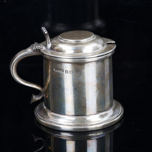 183 - A George V silver lidded tankard design mustard pot, with blue glass liner, by A Marston & Co, hallm... 