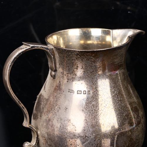 213 - A George V silver jug, baluster form, by Mappin & Webb, hallmarks London 1930, height 13.5cm, 12.6oz