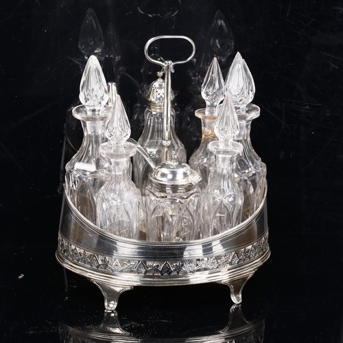 215 - A George III silver-mounted table cruet set, containing 8 glass bottles with stoppers and lids, by H... 