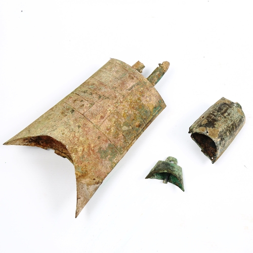 1007 - A Chinese Archaic bronze bell, with relief moulded decoration, length excluding handle 19.5cm, and 2... 