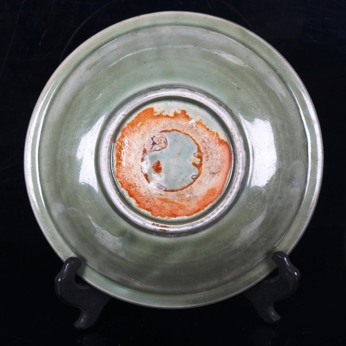 1008 - A Chinese celadon glaze bowl with relief moulded decoration, diameter 30cm