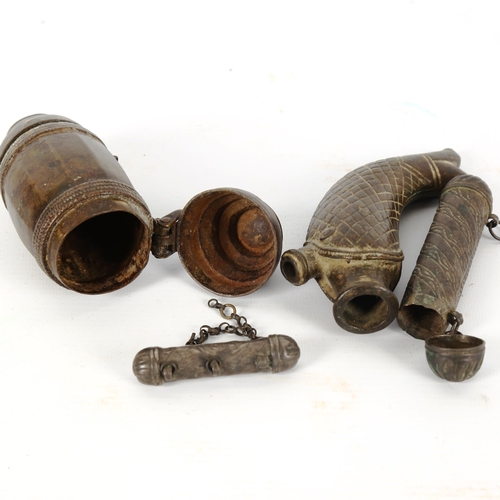 1011 - A group of African/Middle Eastern metal scroll cases, and a bronze fish design flask (length 13cm) (... 