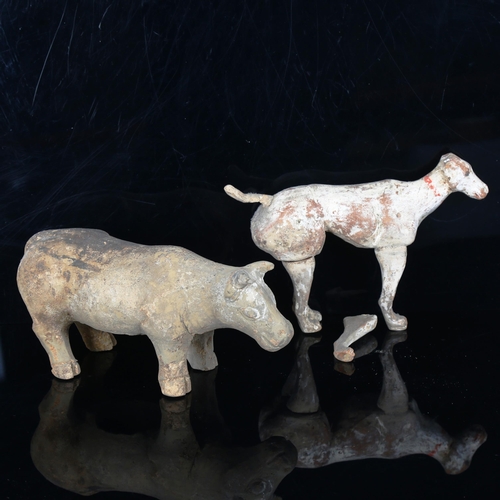 1018 - A Chinese Tang Dynasty pottery buffalo, length 23cm, and a pottery standing dog, length 21cm (2)