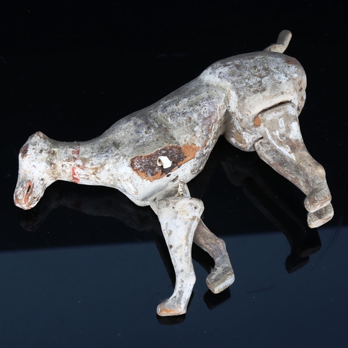 1018 - A Chinese Tang Dynasty pottery buffalo, length 23cm, and a pottery standing dog, length 21cm (2)