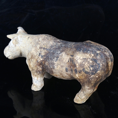 1018 - A Chinese Tang Dynasty pottery buffalo, length 23cm, and a pottery standing dog, length 21cm (2)