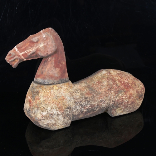 1019 - A Chinese Tang Dynasty pottery horse with separate head (no legs), body length 31cm